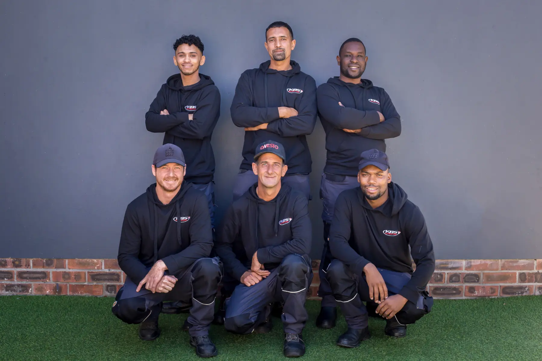 Experienced electrical contractors Cape Town team posing in branded uniforms before conducting electrical installation and maintenance work