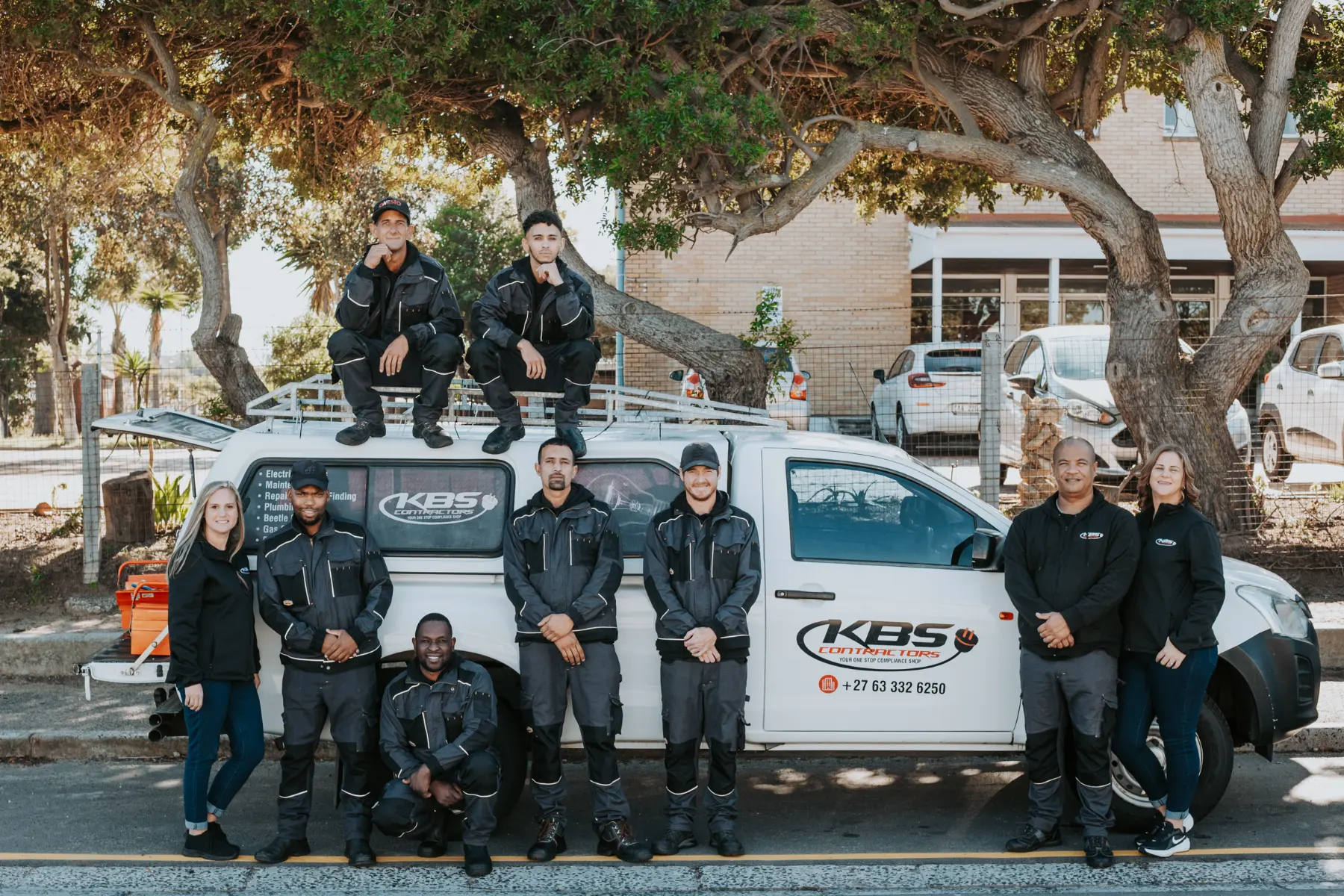 Electrical contractors Cape Town team standing beside KBS service vehicle for electrical installation, maintenance and compliance inspections